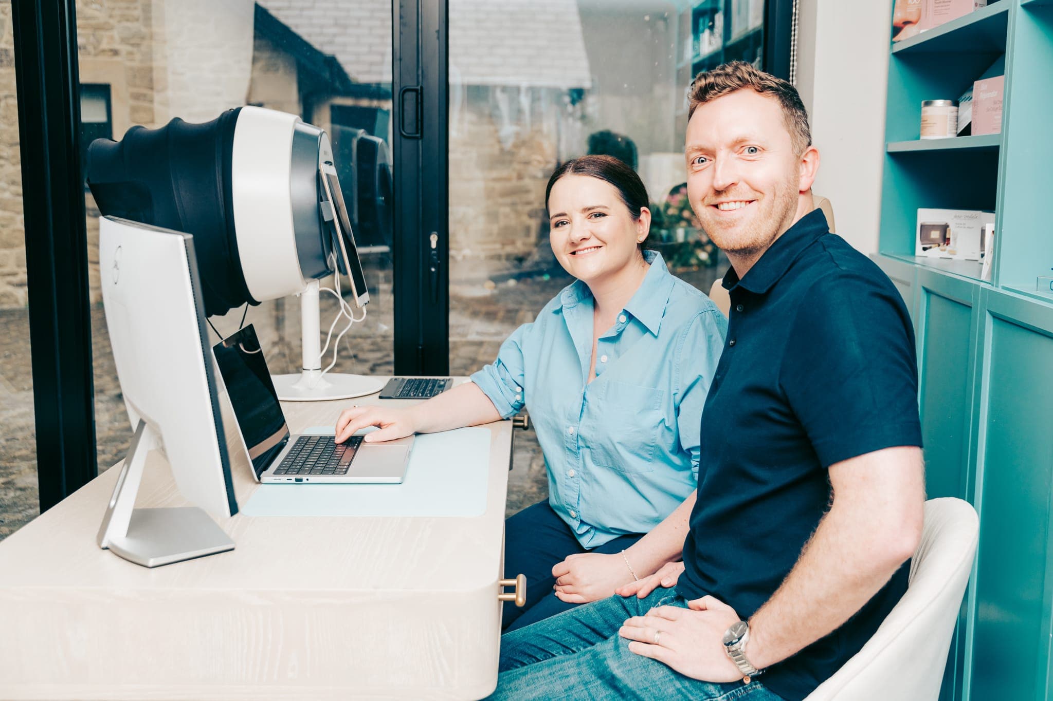Dr Gemma Wormwell and James Wormwell collaborating at their clinic desk